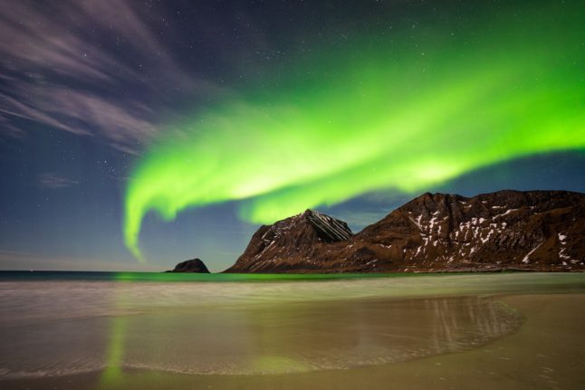 Pictured are the Northern Lights above Haukland Beach.