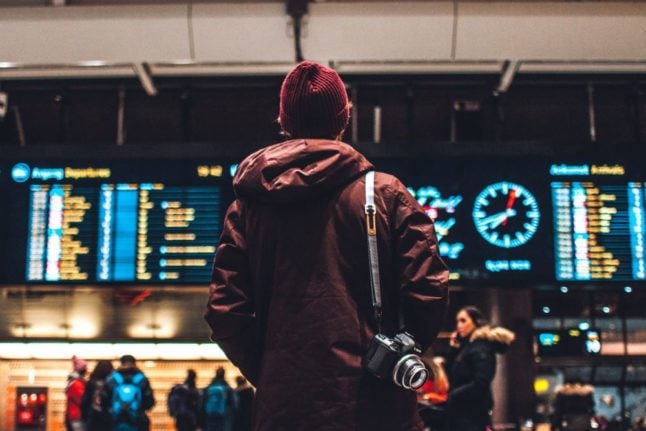 Pictured is passenger at a rail station in Norway.