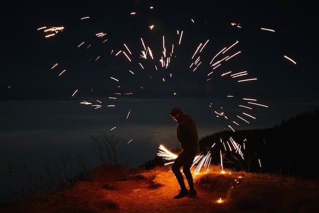 A person setting off fireworks on Grenchenberg, Grenchen, Switzerland.