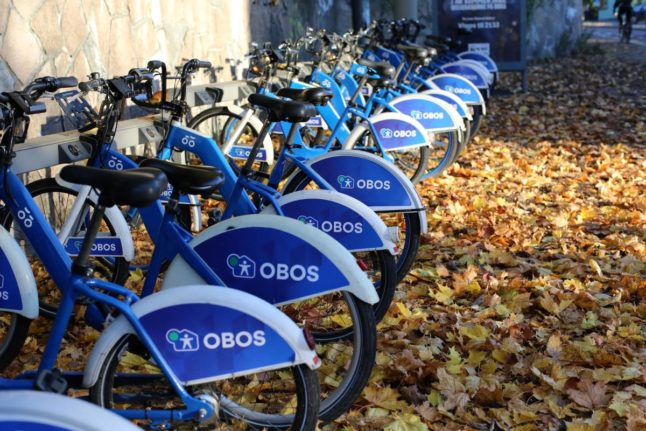 Pictured is a row of rental bikes in Oslo.