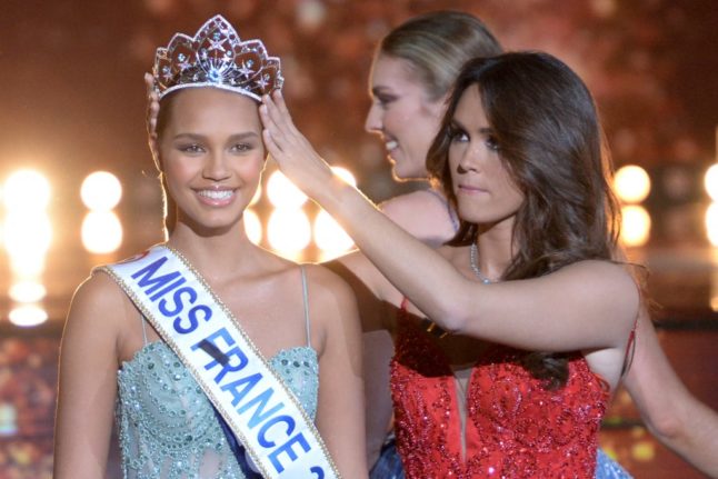 Newly elected Miss France Indira Ampiot (L) is crowned by Miss France 2022 Diane Leyre (C) during the Miss France 2023 beauty contest