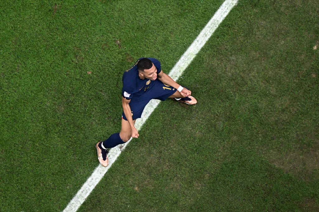 France's forward #10 Kylian Mbappe celebrates the second goal of his team during the Qatar 2022 World Cup final 