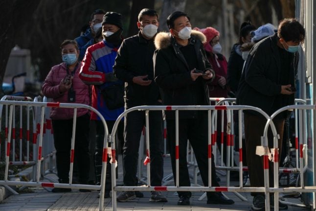 Citizens of China queue up at a test centre in Beijing. 