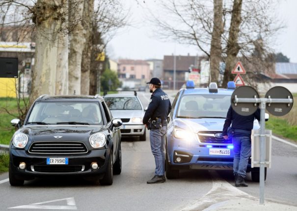 Police officers stopping cars in Italy