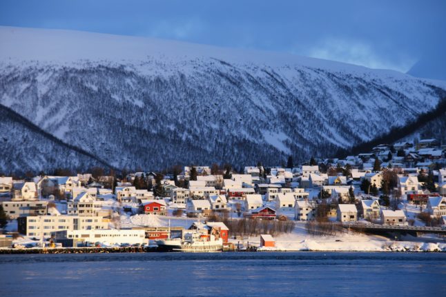 Pictured are homes on the shore in Tromsø.