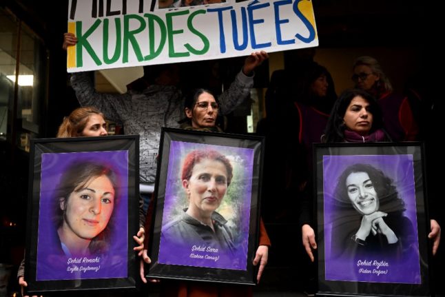 Protestors hold portraits of Kurdish activists Leyla Soylemez (L), Sakine Cansiz (C) and Fidan Dogan (R), who were murdered in Paris in January 2013