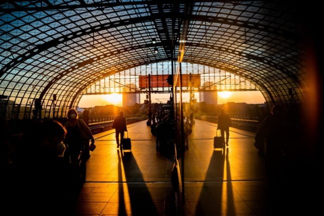 A train station in Berlin at dusk.