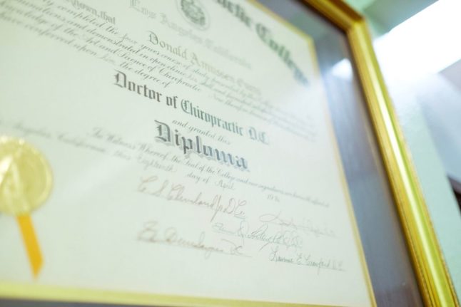 Pictured is a diploma certifcate.