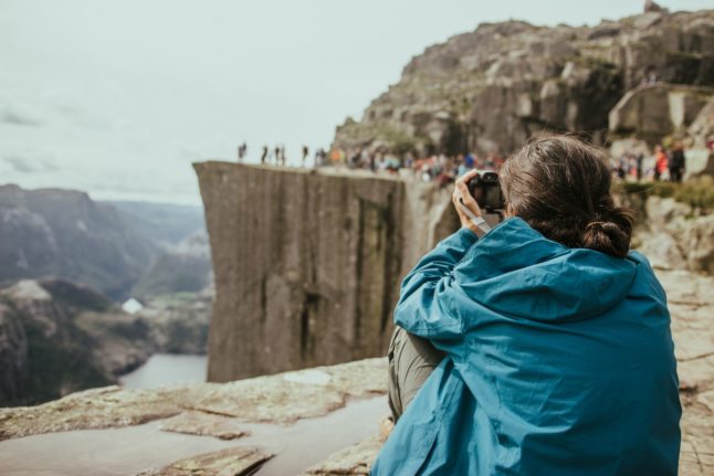 Pictured is a person at Pulpit Rock.