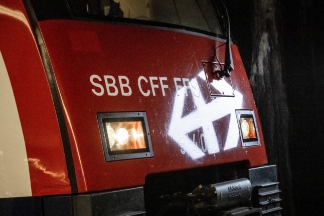 A logo of the Swiss Federal Railways (SBB / CFF) is reflected on a locomotive at the Zurich's main train station on November 8, 2022. 
