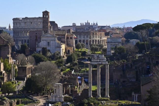 A general view taken from Capitoline Hill shows the ancient Roman Forum and the Colosseum monument on January 13, 2022 in Rome.