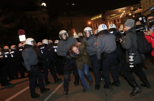 A demonstrator is arrested by policemen as he protests against the Wiener Akademikerball, a ball organised by the far-right Austrian Freedom Party, near the Hofburg Palace in Vienna on February, 1 2013.