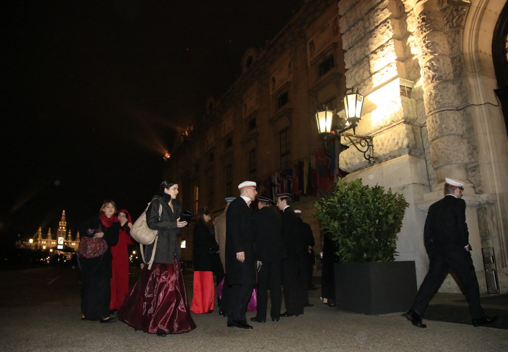 Guests arrive to attend the Wiener Akademikerball, a ball organised by the far-right Austrian Freedom Party, at the Hofburg Palace in Vienna on February, 1 2013.  