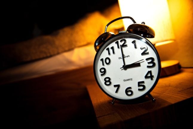 Alarm clock next to bed