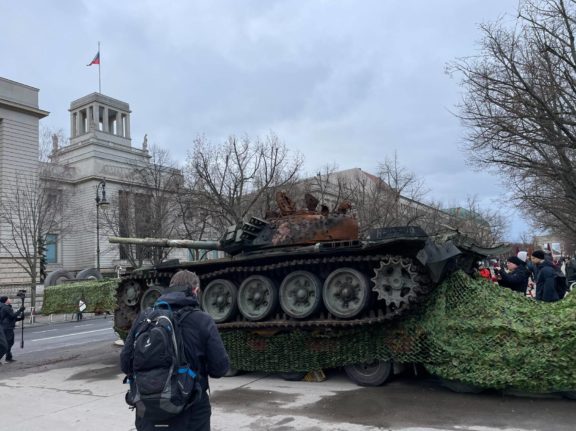 Activists park burnt-out tank outside Russian Embassy in Berlin