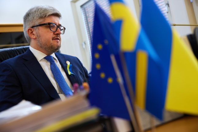 Ukraine's ambassador to Sweden Andrii Plakhotniuk at his desk at the Ukrainian embassy in Stockholm