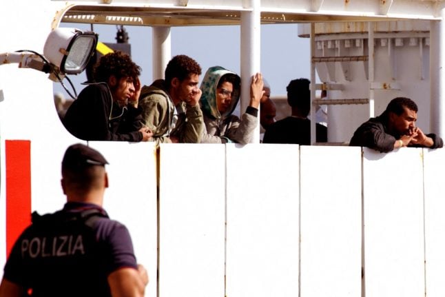 Migrants on an Italian coast guard vessel