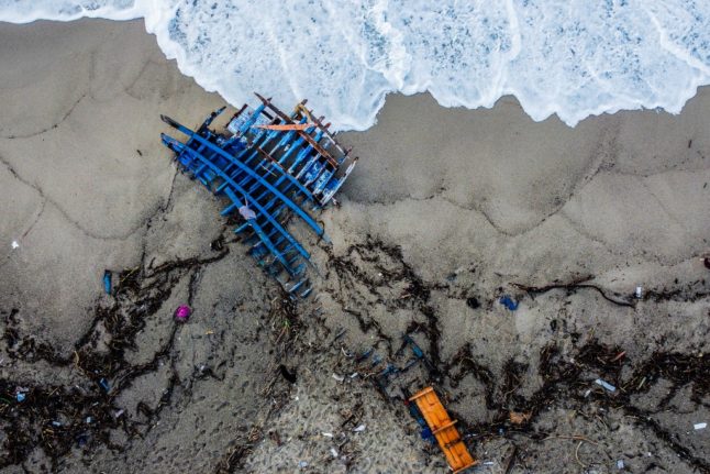 Wreckage on Italian beach after a migrant boat wreck