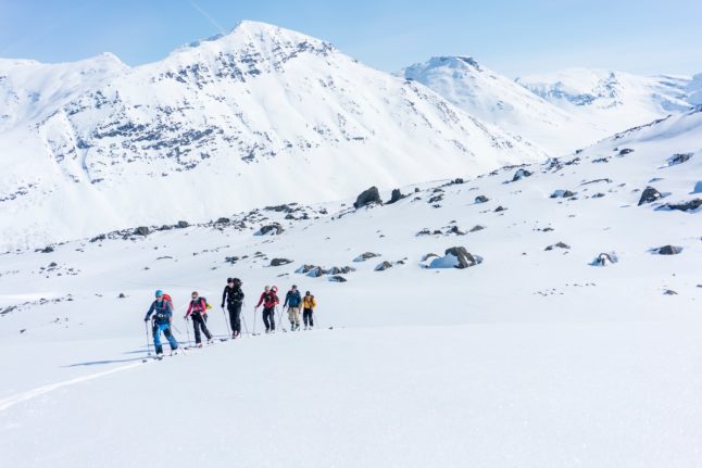 Pictured are skiers in the Lyngen Alps in Norway.