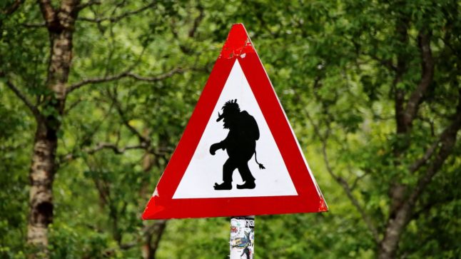 Pictured is a street sign warning of trolls.