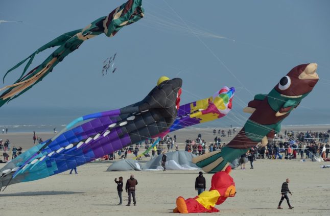 Four badly hurt after car hits crowd at French kite festival