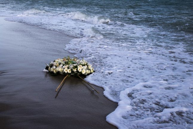 A wreath of flowers thrown into the sea at the site of a February 26, 2023 shipwreck off Steccato di Cutro, southern Italy.