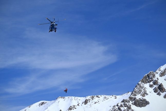 Rescue helicopter over Italian French Alps