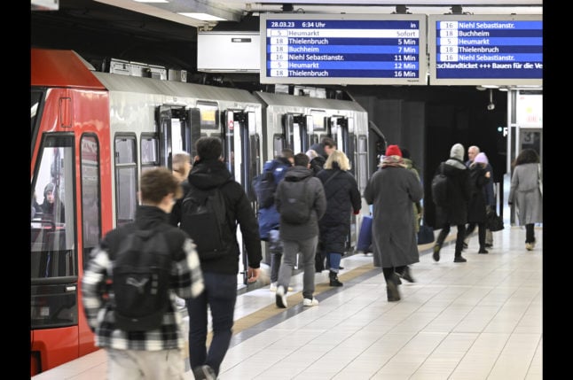 Passengers leave the KVB subway at the main station in Cologne.