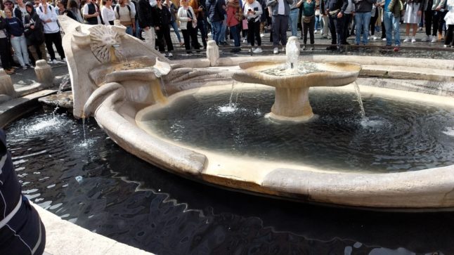 Climate activists turn landmark Rome fountain black