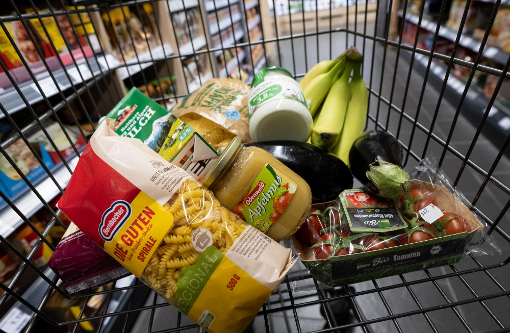 Popular food items in Germany displayed in a shopping cart in Neubiberg, Bavaria.