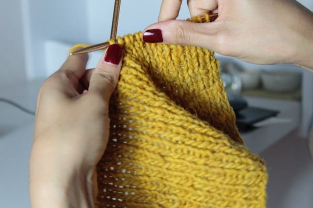 A person knitting