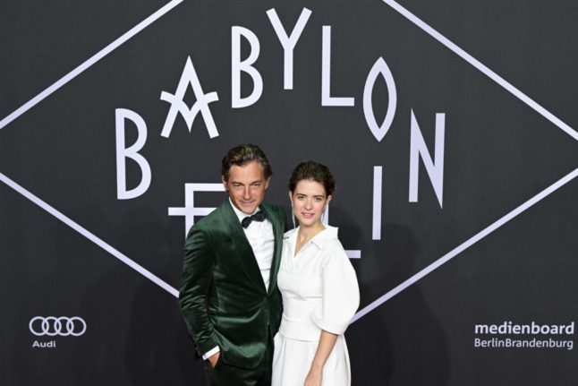 Actors Volker Bruch and Liv Lisa Fries pose on the red carpet upon arrival for the premiere of the 'Babylon Berlin' tv series' fourth season, at the Delphi Filmpalast in Berlin on September 20, 2022.