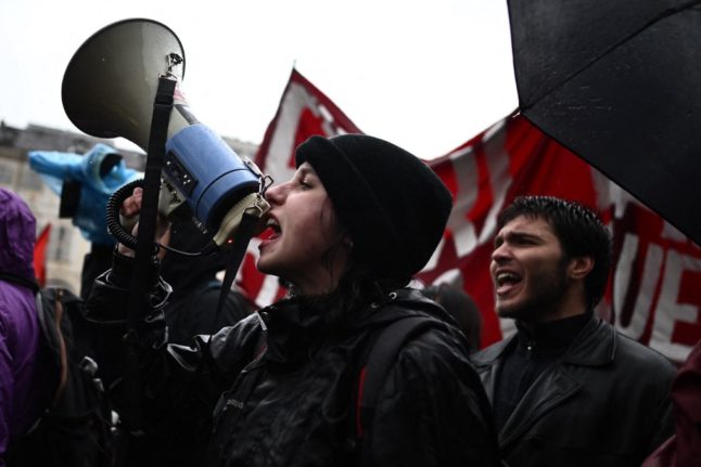 A protestor shouts slogans during a demonstration on May Day (Labour Day), to mark the international day of the workers, in Turin on May 1, 2023.