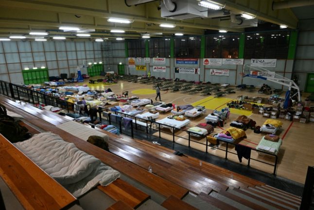 Residents of Castel Bolognese in Emilia Romagna take shelter in a sports hall after being evacuated from their homes.