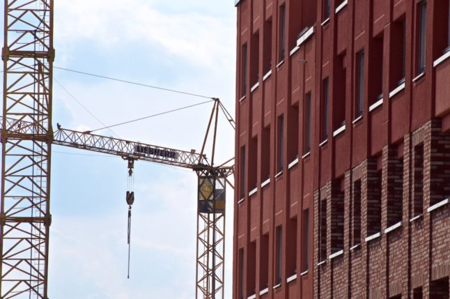 A new residential building and construction cranes in Munich's Freiham district in April 2022.