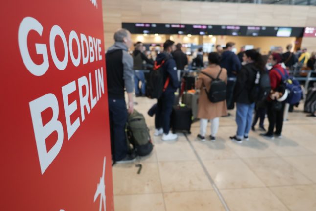 Passengers queue at BER airport in Berlin.