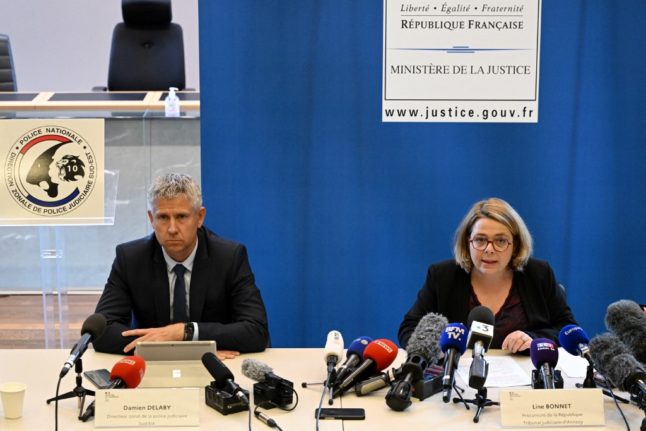 French Prosecutor Line Bonnet (R) and Judicial Police Director Damien Delaby (L) hold a press conference in Annecy on June 10, 2023 following the recent mass stabbing.