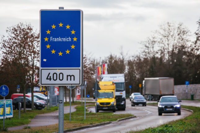 A sign near the German-French border in Breisach indicates the nearby border crossing.