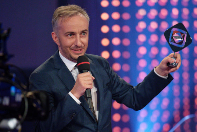 Comedian Jan Böhmermann on stage at the 59th Grimme Award ceremony in April 2023, with the award in the category 