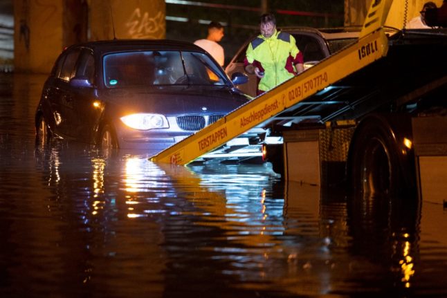 A car submerged in water in Duisburg. 