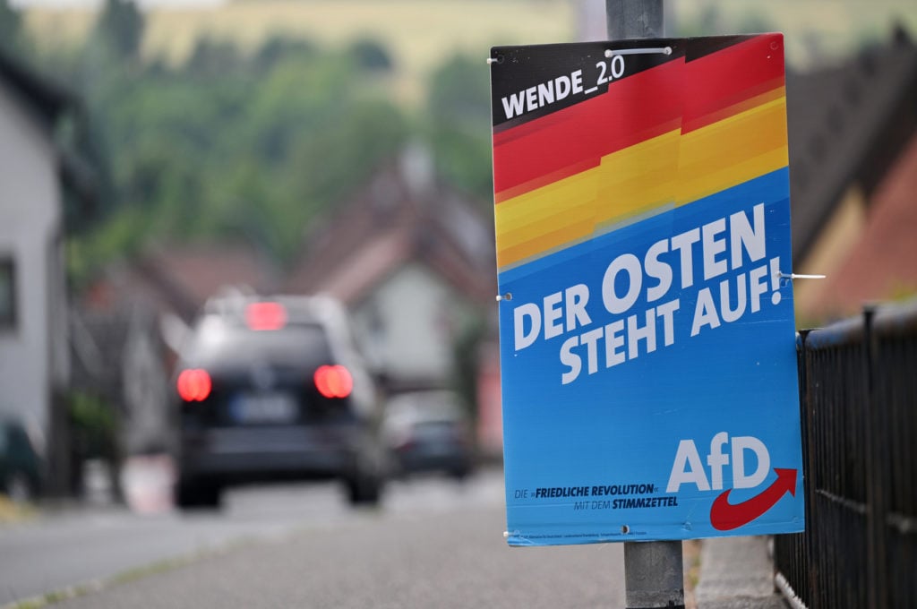An AfD election poster with the slogan "The East stands up!" hangs on a main road in the district of Sonneberg, Thuringia.