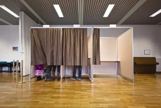 People in Switzerland voting in a referendum.