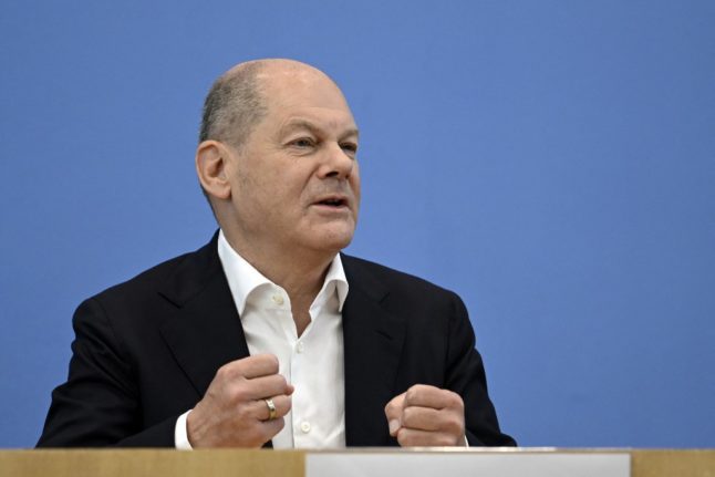 German Chancellor Olaf Scholz gestures as he addresses a summer press conference on domestic policy and diplomacy in Berlin on July 14, 2023.
