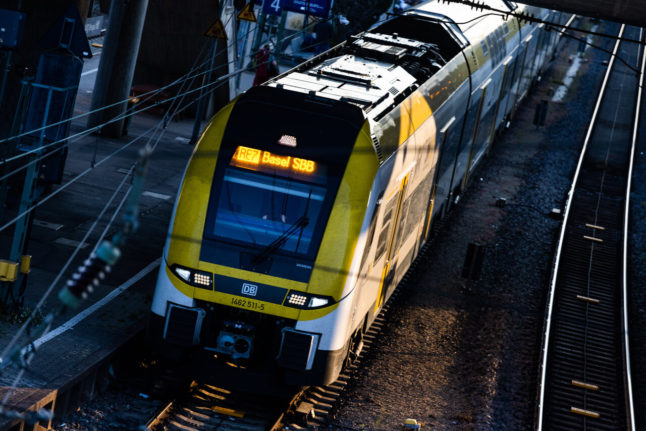 A regional Deutsche Bahn train bound for Basel leaves Freiburg main station.