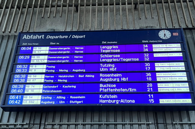In Munich's main train station, a display board informs passengers about train cancellations following storms in Bavaria.