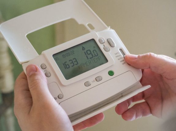 Pictured is a person using a smart meter.