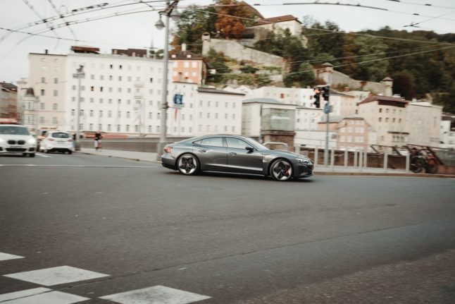 A car drives through a street in Salzburg, Austria. 