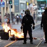 Three French police charged over man’s death during riots