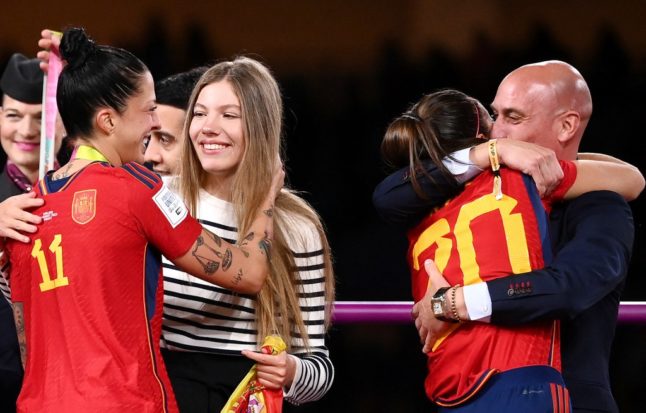 Spain's defender Rocio Galvez is congratulated by RFEF president Luis Rubiales (R) next to Spain's Jennifer Hermoso after Spain's football World Cup final win