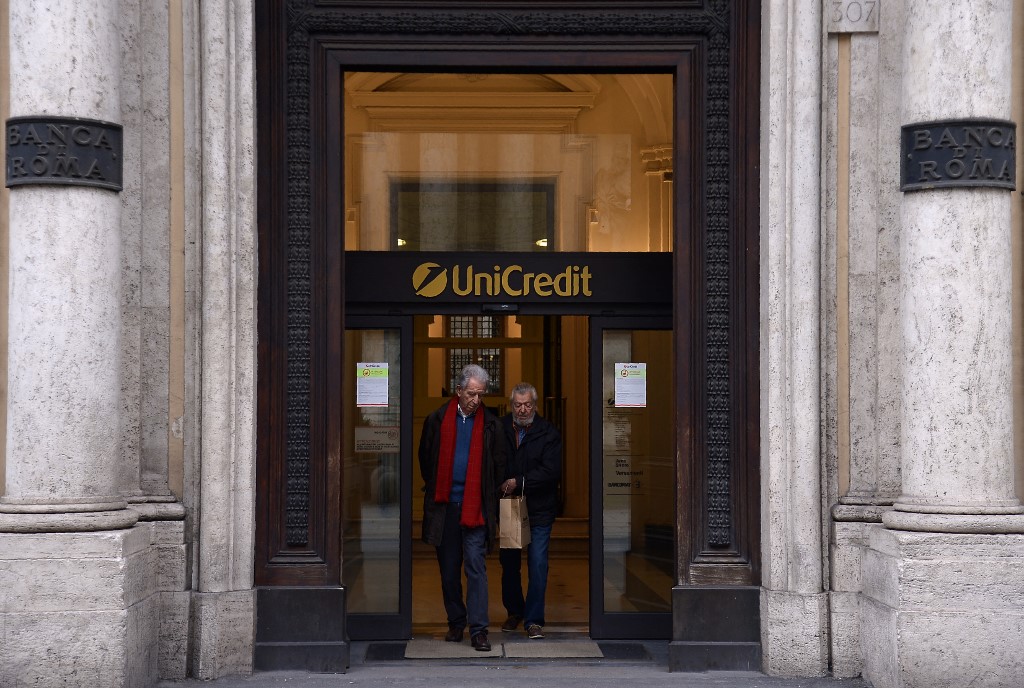 Customers leave Unicredit bank in Rome